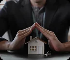 Hands protecting house