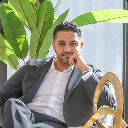 Ahmed Kazweeny seated in an office setting